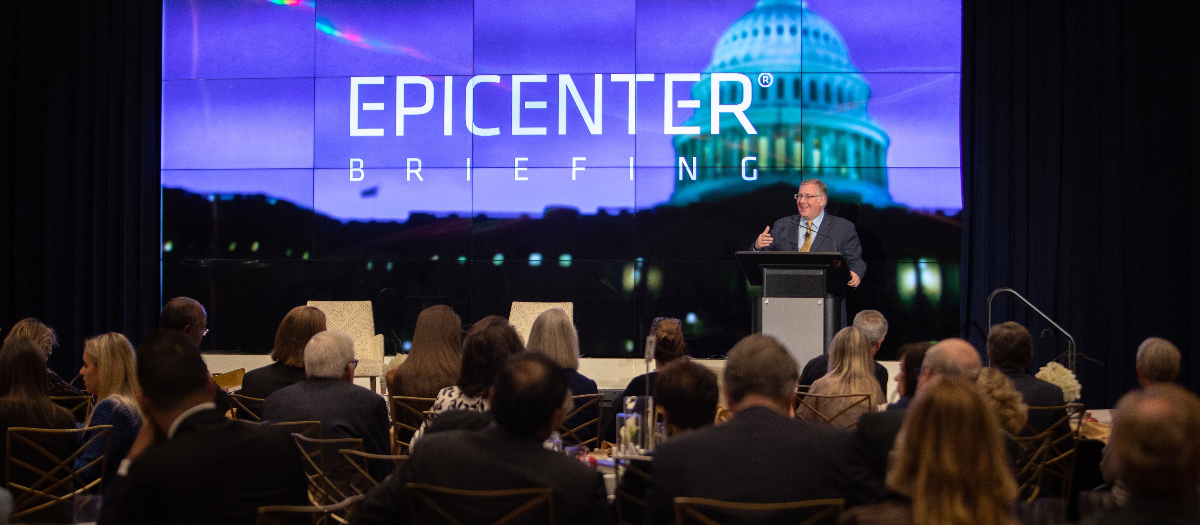 Joel C Rosenberg on a stage speaking to a room full of people at the Epicenter Summit