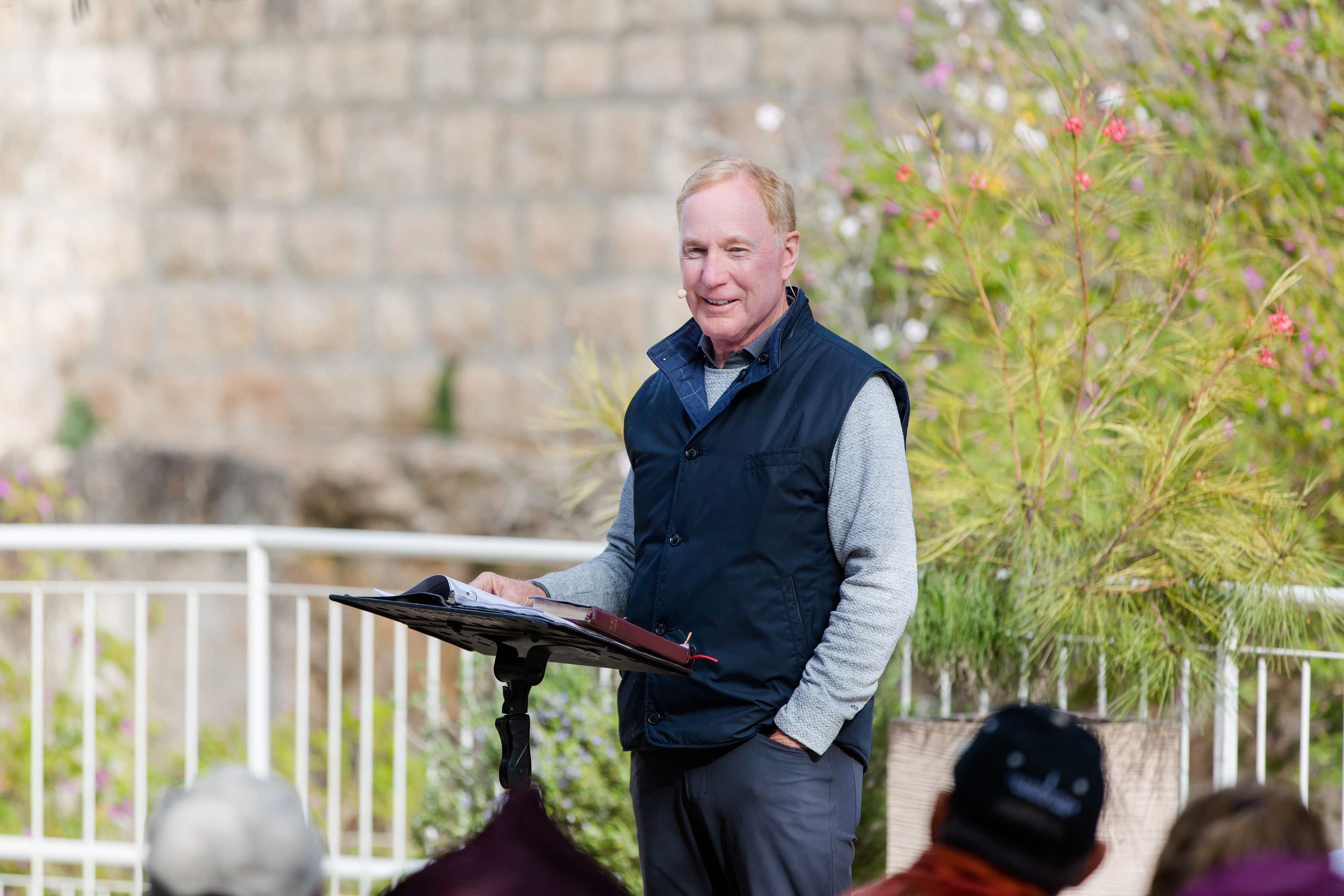 Max Lucado speaking to a group of people in Israel
