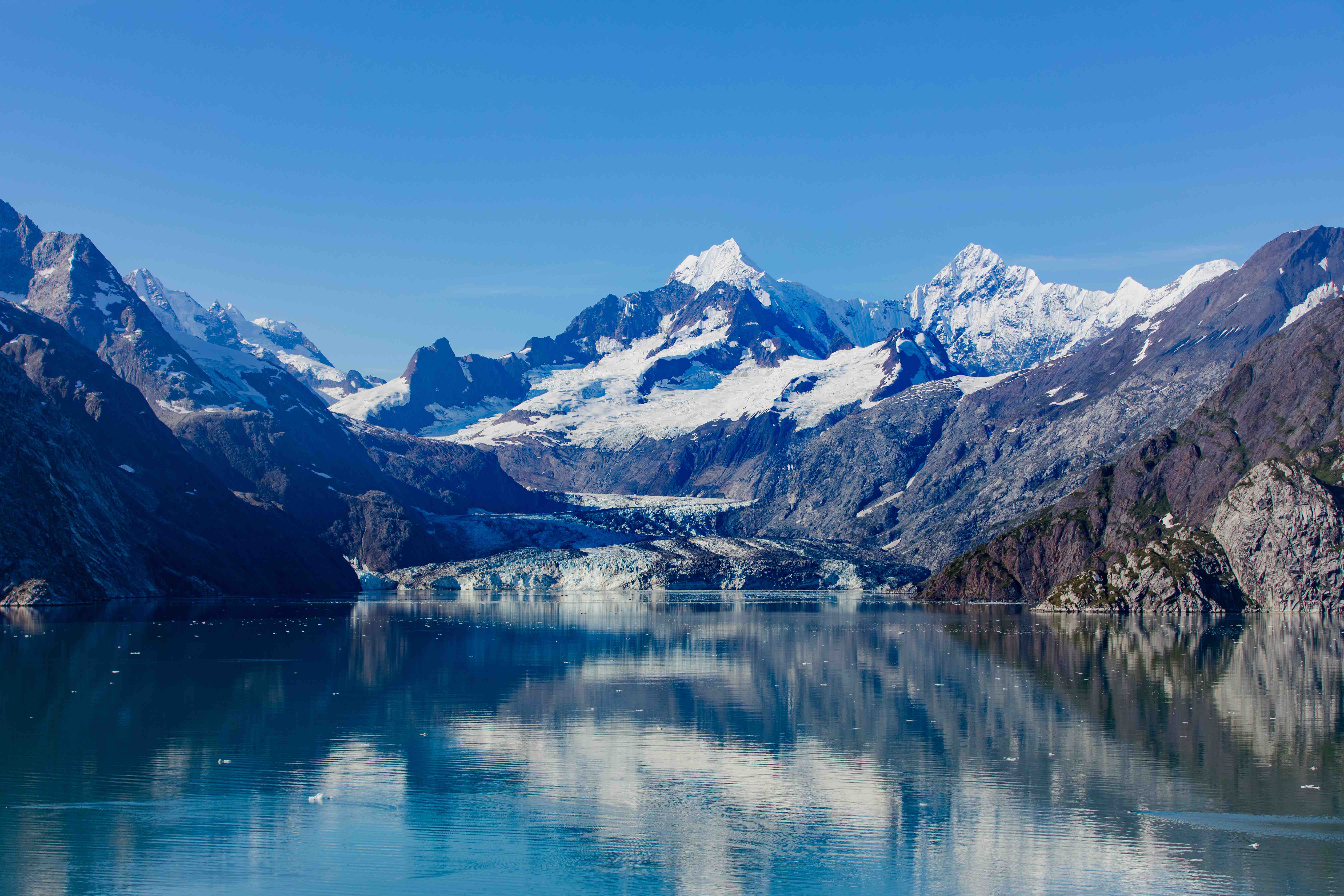 Snow-covered Sawyer Glacier towering above the water