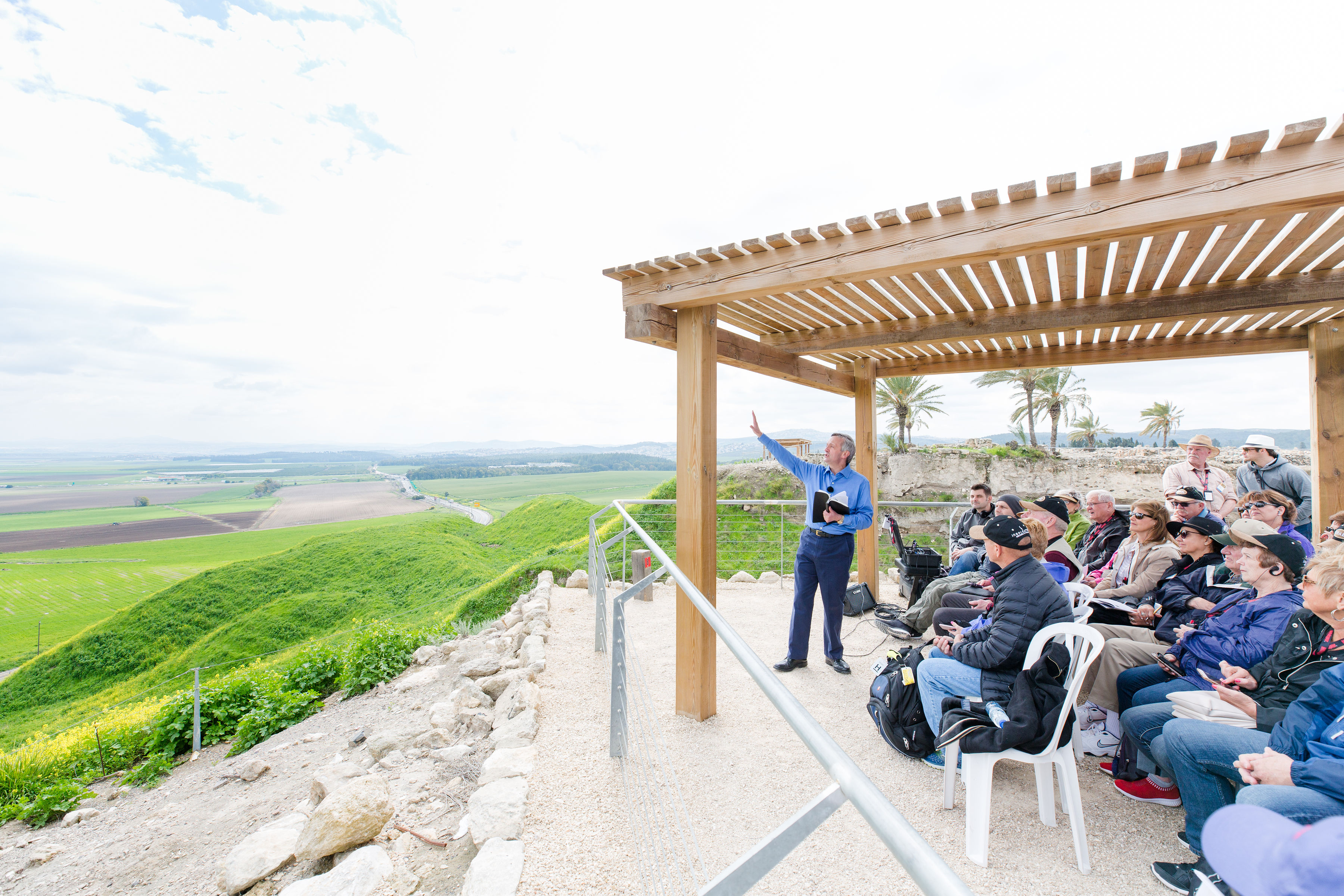 Group of people on Mount Megiddo overlooking the valley below