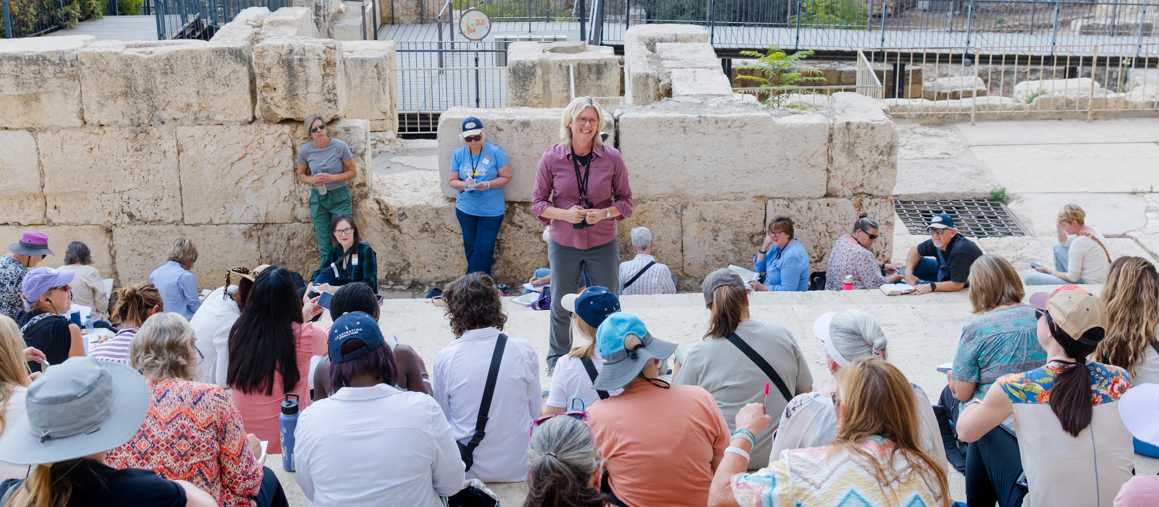 Kristi McLelland smiling and speaking to a group of people