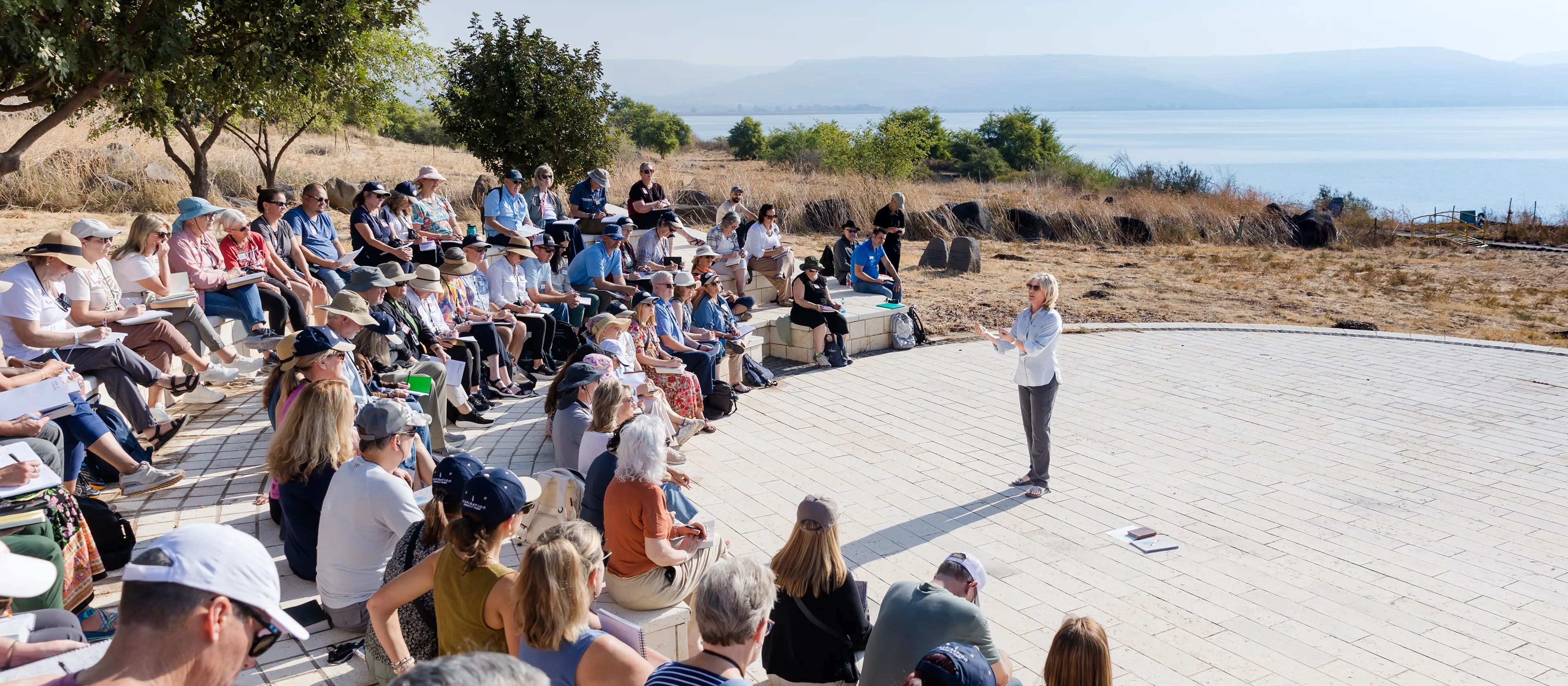 Kristi McLelland in Israel speaking to a large group of people