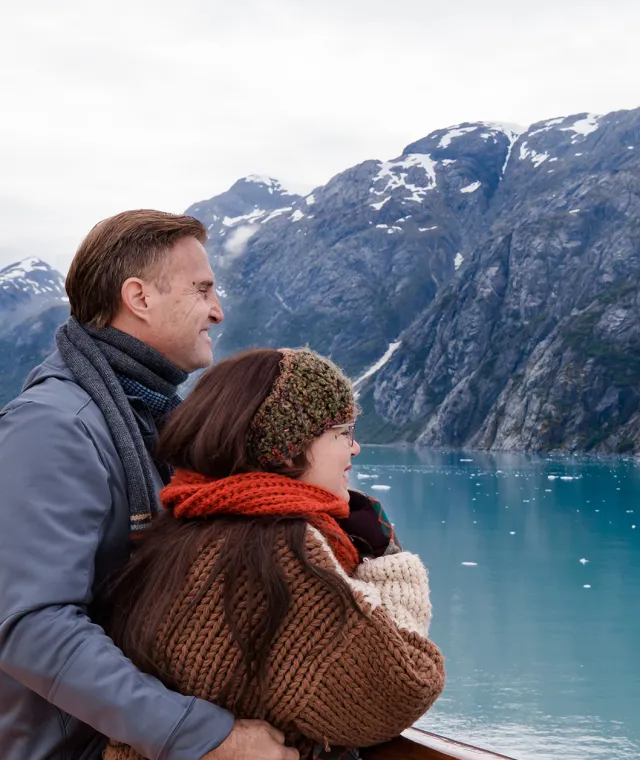 couples looking out cruise ship