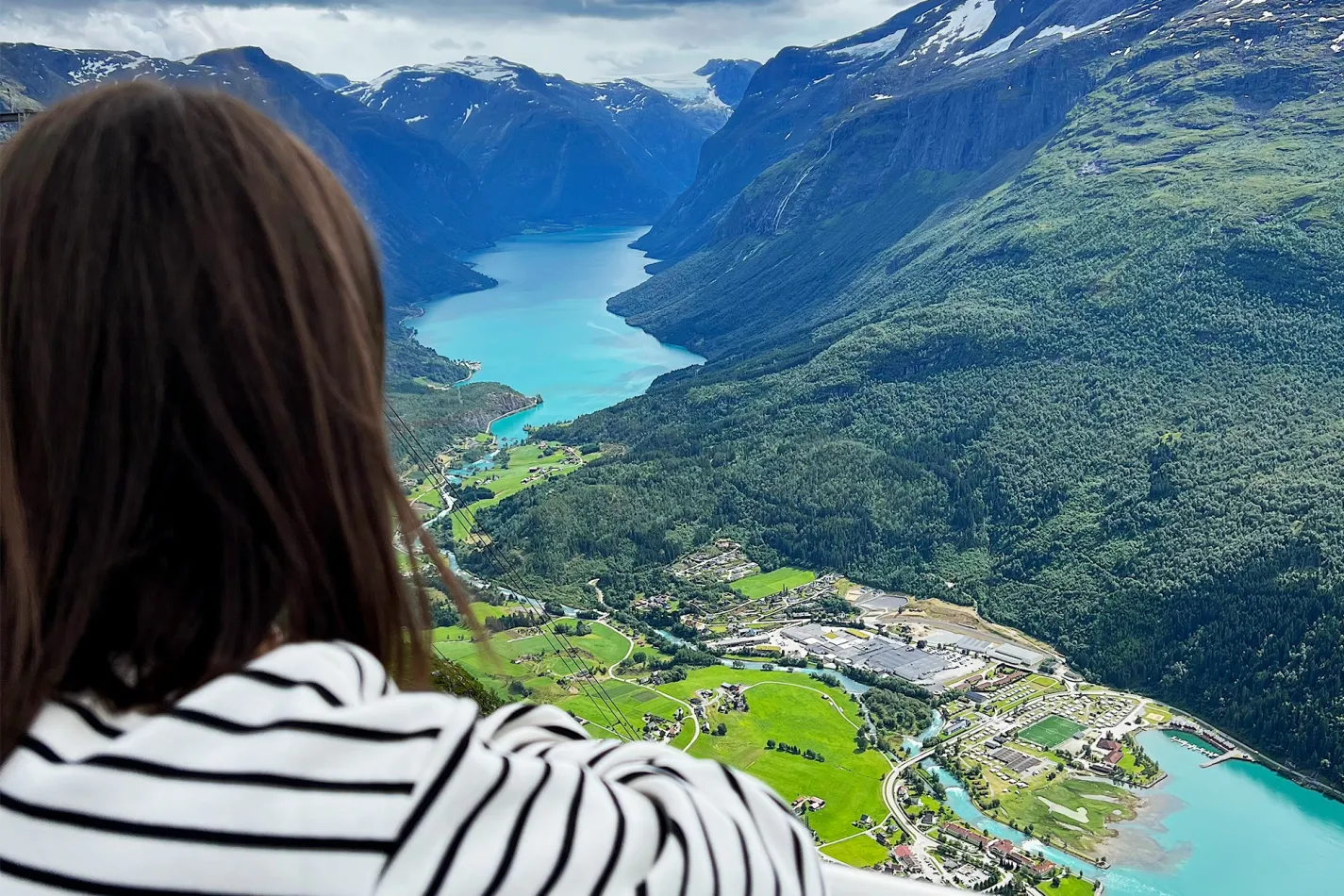 Woman looking out over a breathtaking view of a valley