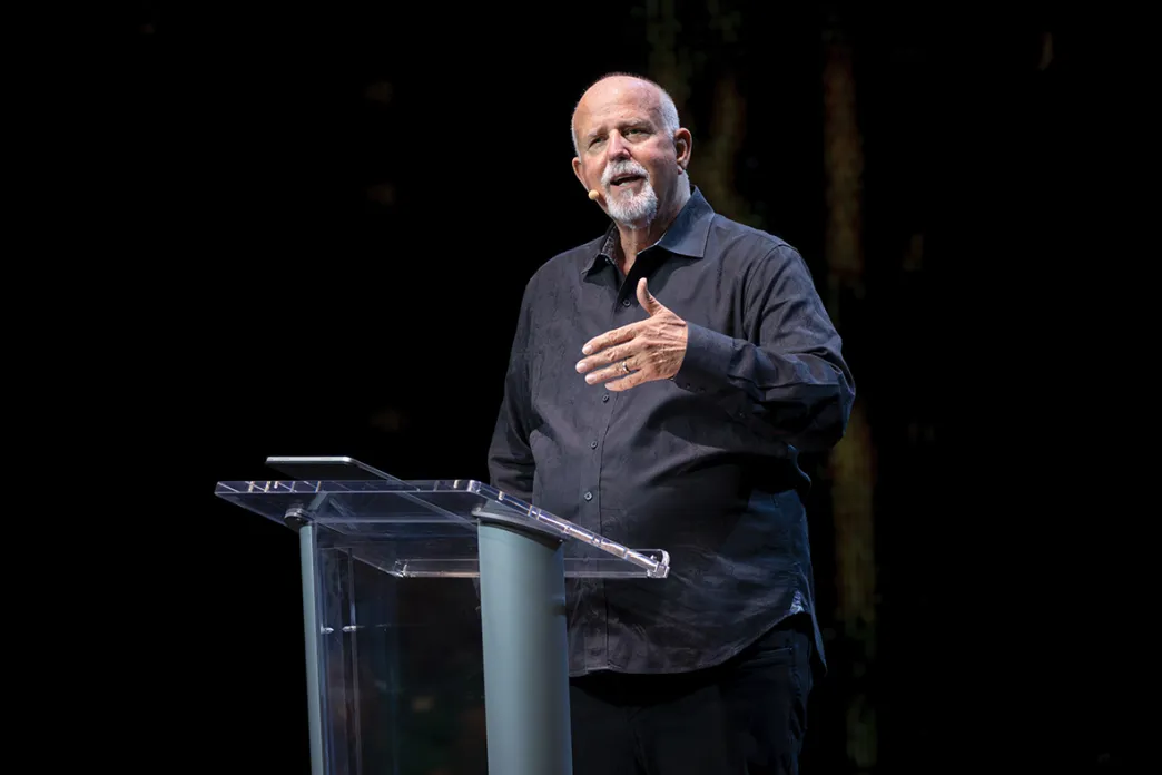 Barry Stagner standing at a podium speaking