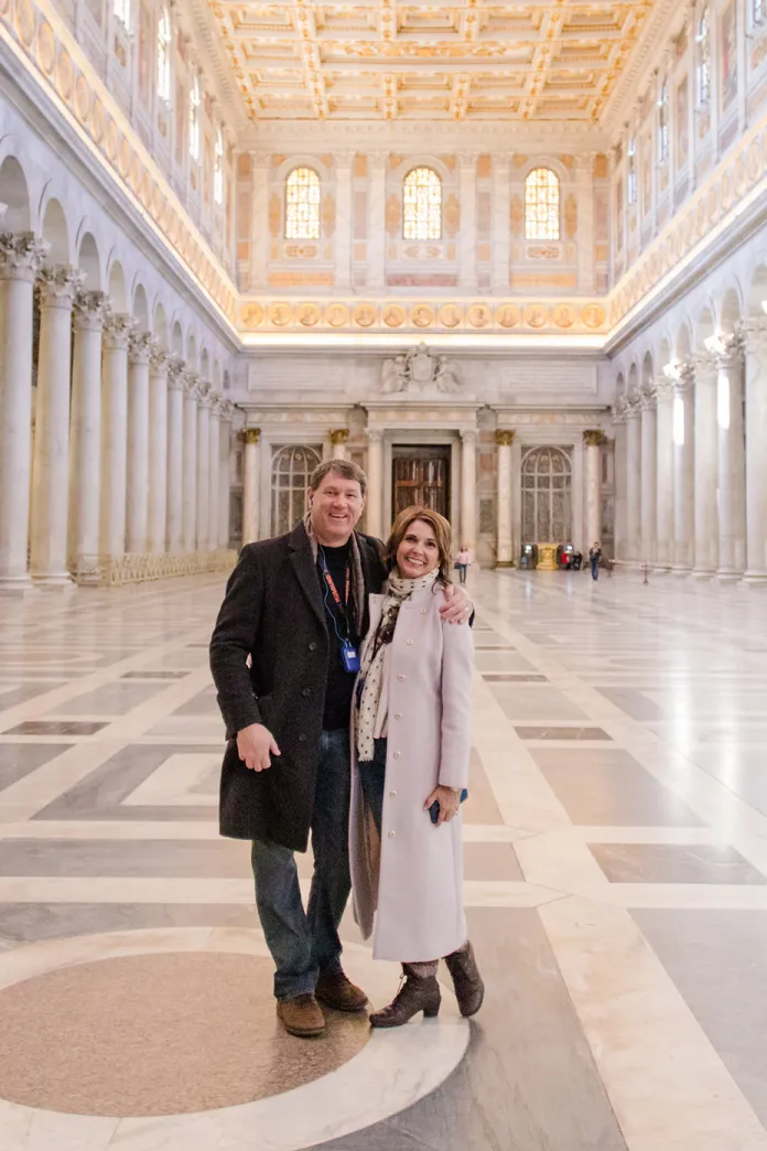 A couple standing inside the Basilica of Saint Paul