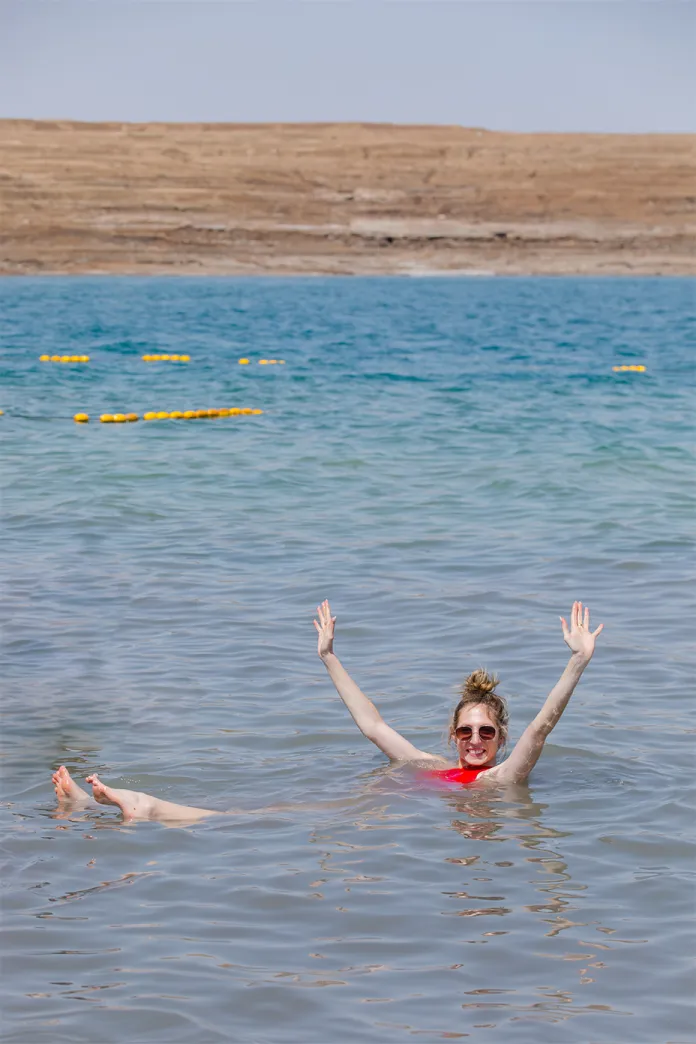 Woman floating in the Dead Sea