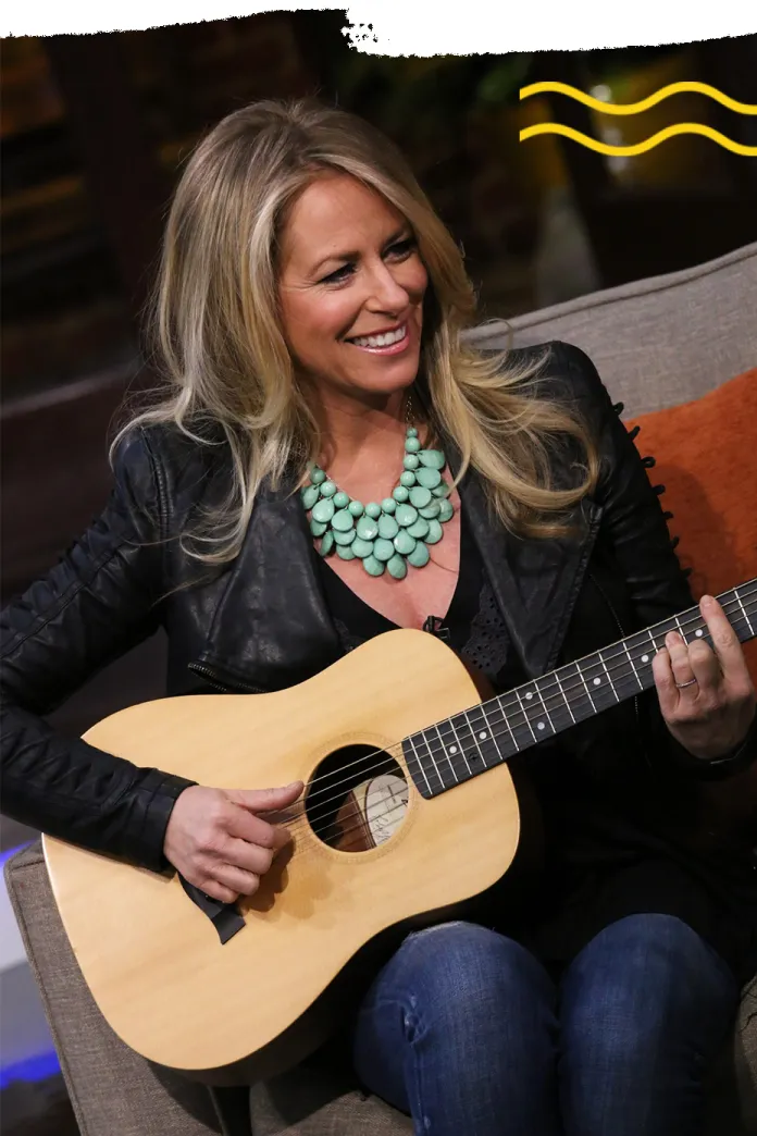 Deana Carter playing guitar