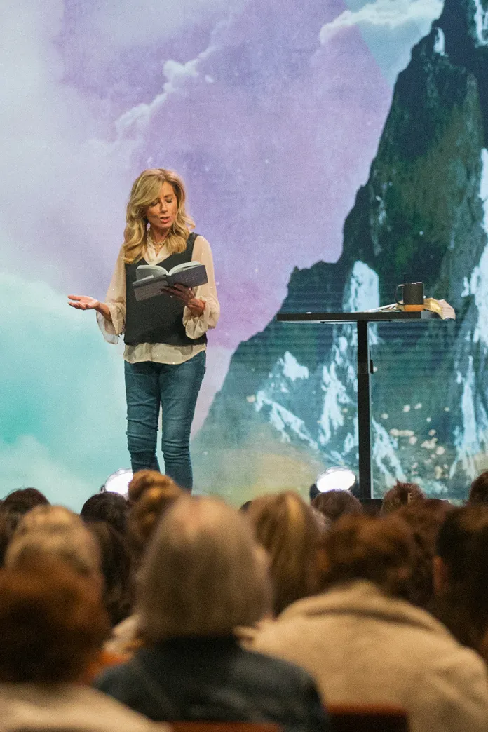 Beth Moore teaching on a stage