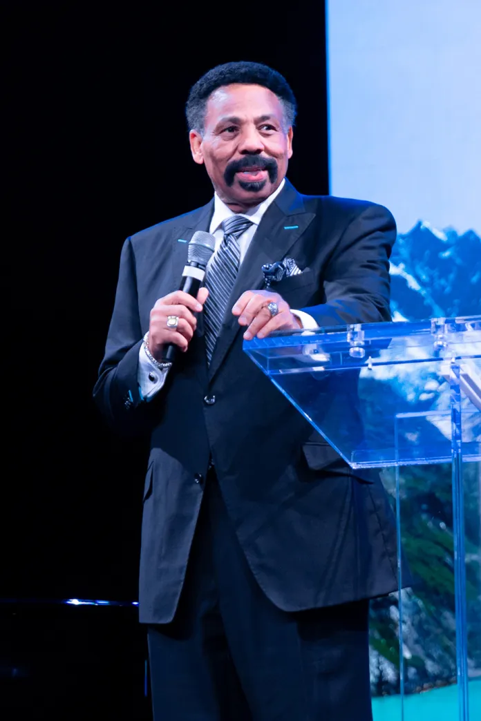 Tony Evans standing on a stage speaking