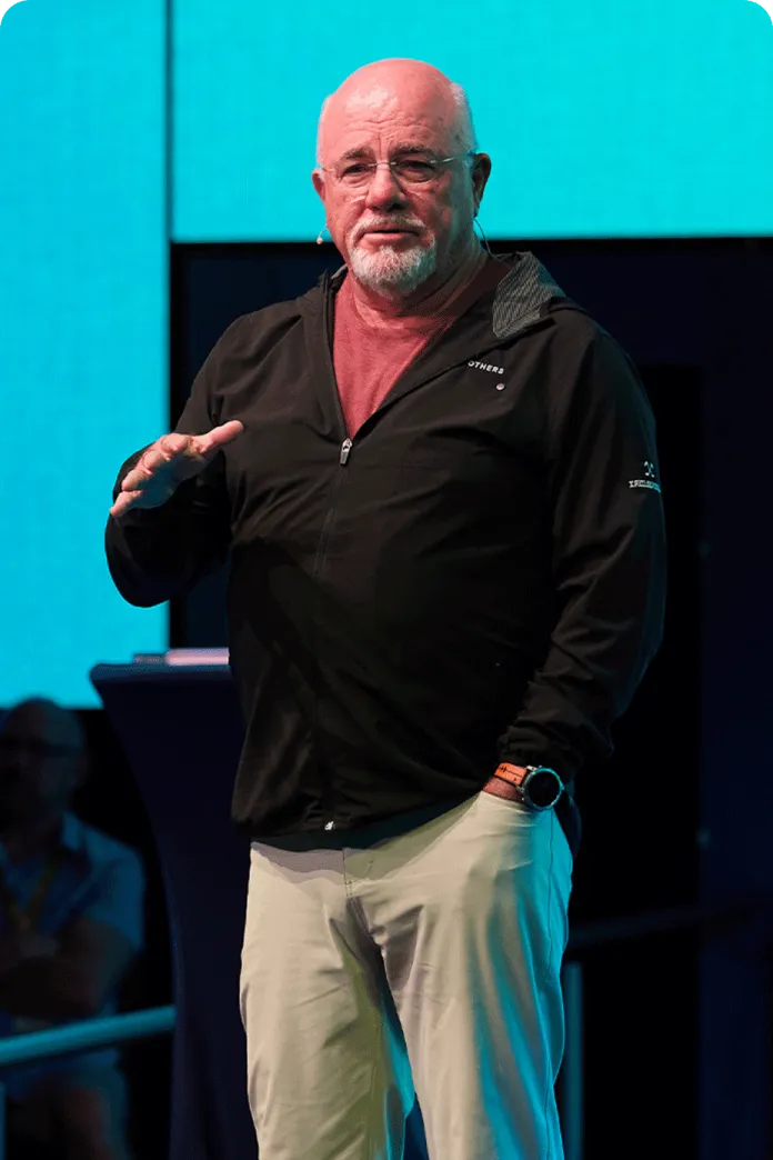 Dave Ramsey speaking on a stage
