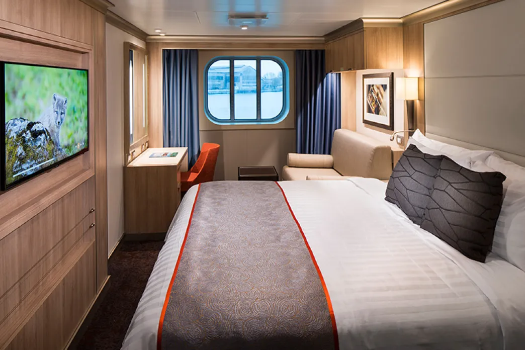 Perfect for guests traveling solo, these comfortable staterooms feature a cabin window and a bed with plush Euro-Top mattress, plus a premium massage showerhead and other modern amenities.