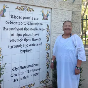 Woman next to sign in Israel