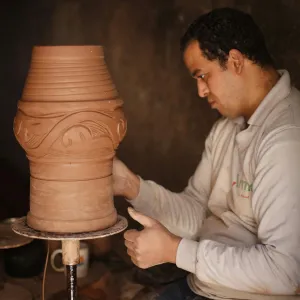 man sculpting in egypt