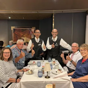 Group of travelers sitting at table