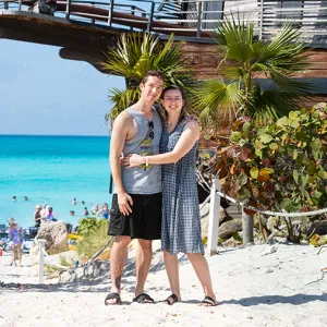 Smiling couple standing together on the beach